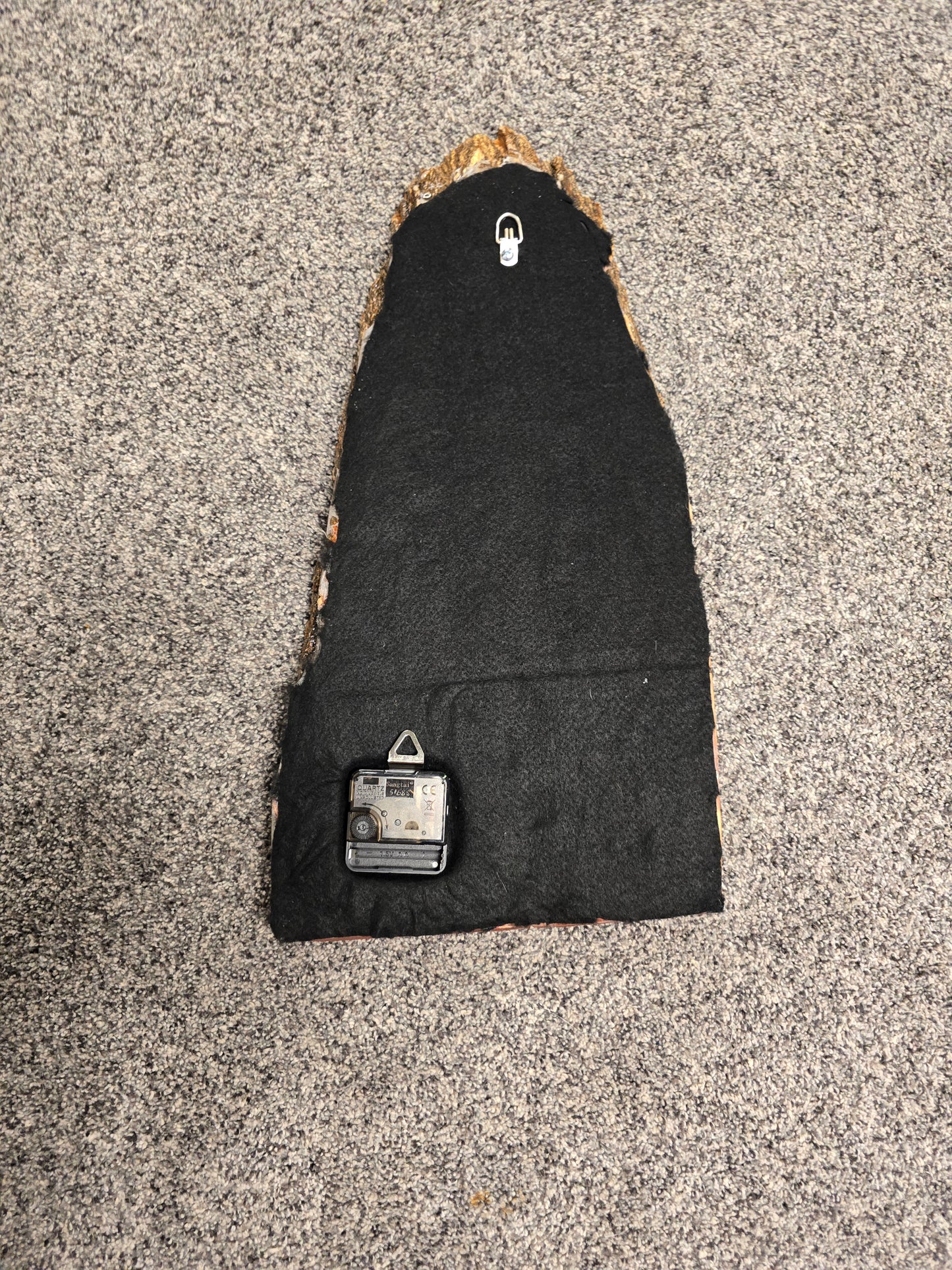 Wood And Resin Lickedenburg Burned Tree Clock. It's 19 By 9 By 1 Inch