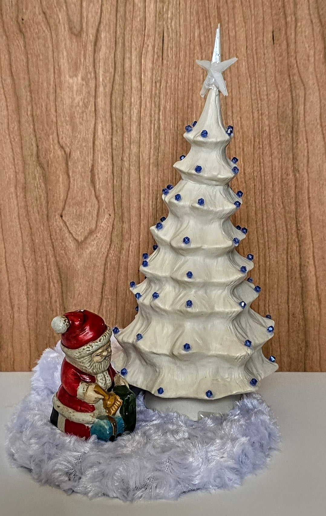 White porcelain Christmas tree with remote lights.