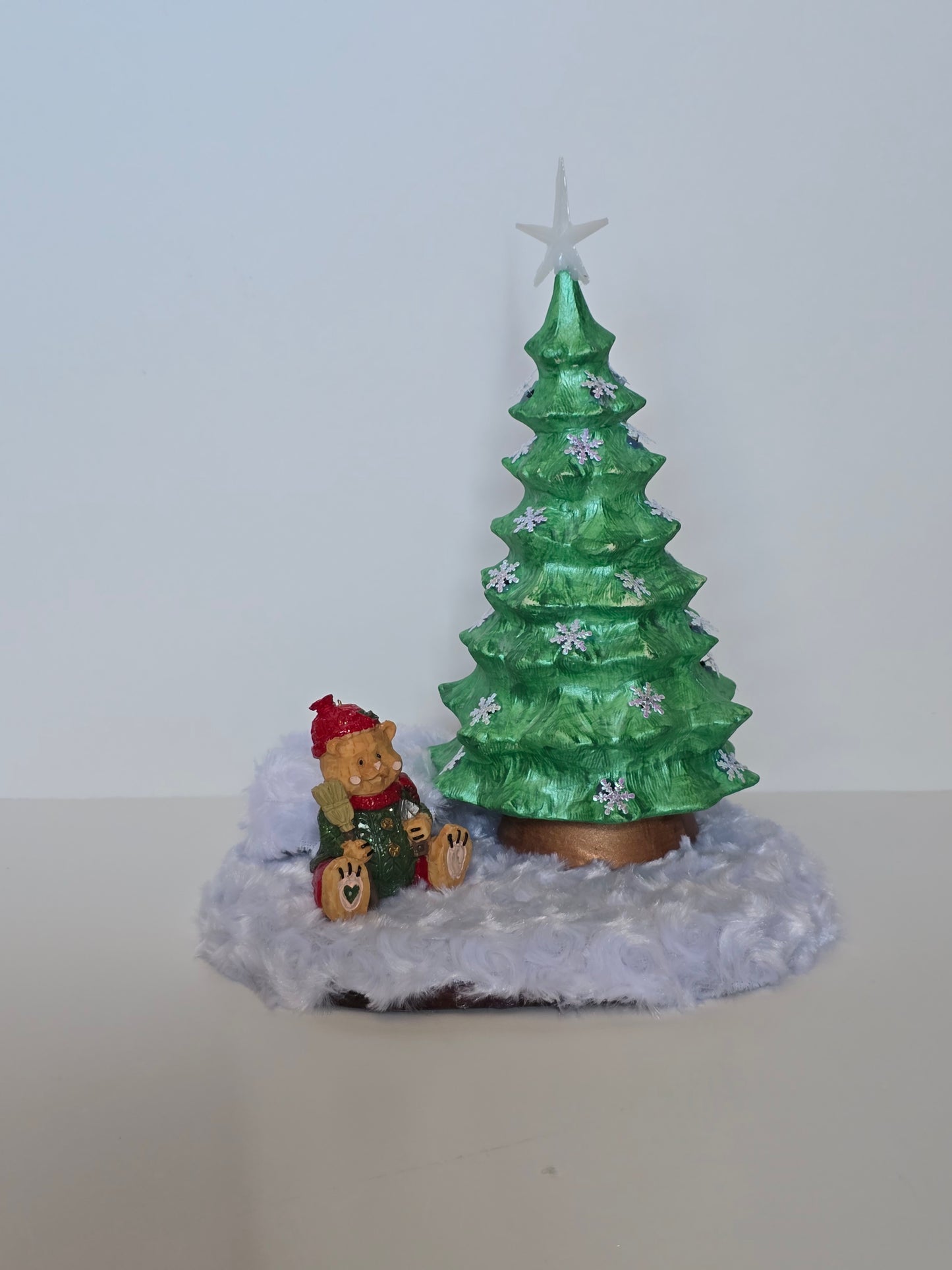 Ceramic Christmas tree with remote colored lights.