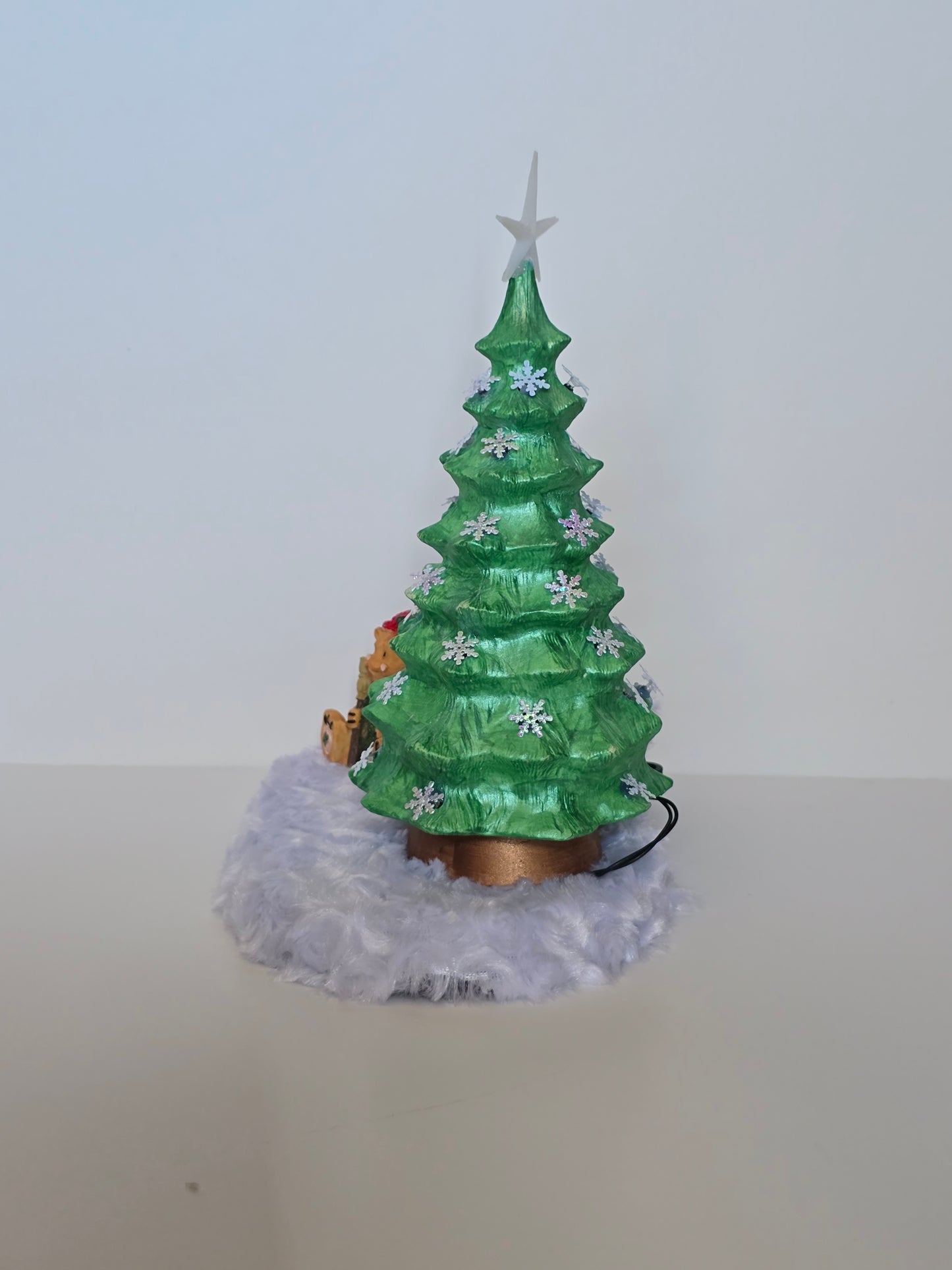 Ceramic Christmas tree with remote colored lights.