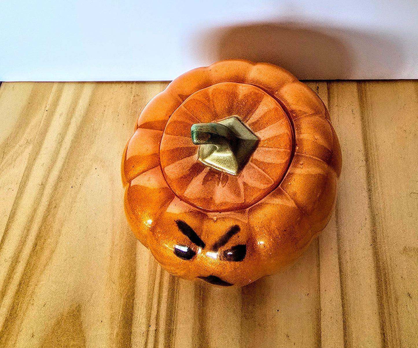The Little Resin Pumpkin is a fun Halloween decoration measuring 4 by 3 inches.