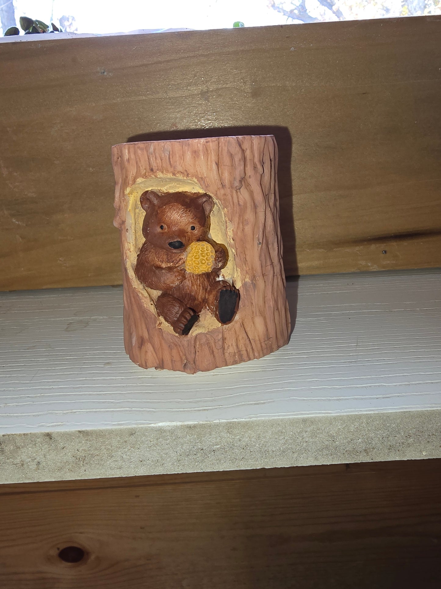 Handmade Little bear in a tree candle. 2 by 3 and 1/2 inch candle. Has a teddy bear in the tree stump.