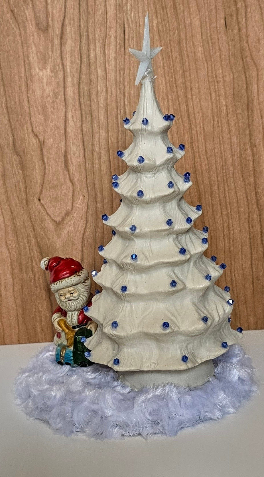 White porcelain Christmas tree with remote lights.