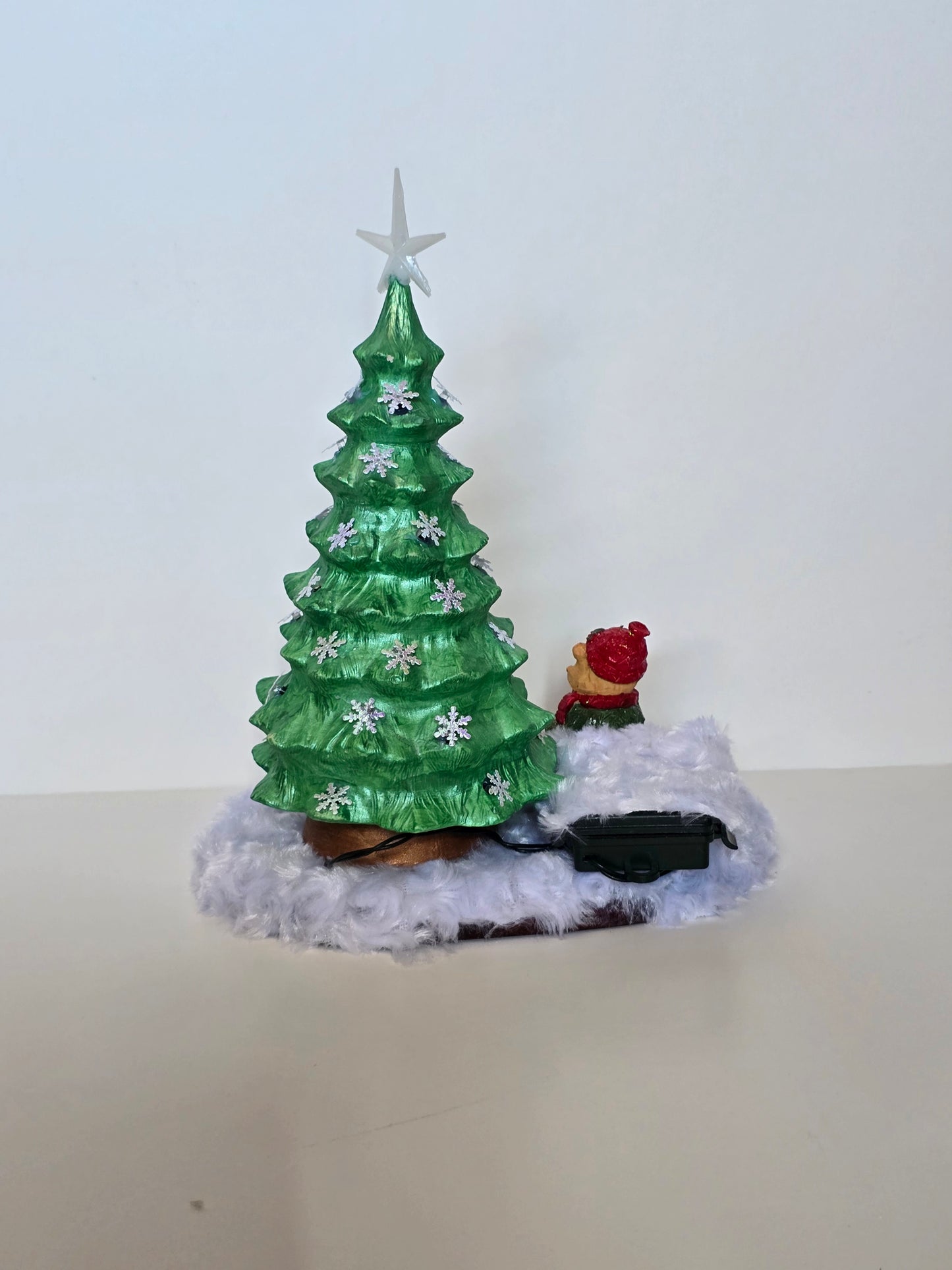 Ceramic Christmas tree with remote colored lights.