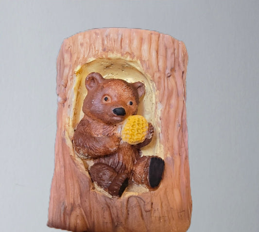 Handmade Little bear in a tree candle. 2 by 3 and 1/2 inch candle. Has a teddy bear in the tree stump.