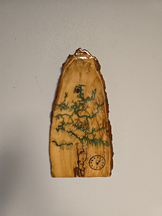 Wood And Resin Lickedenburg Burned Tree Clock. It's 19 By 9 By 1 Inch
