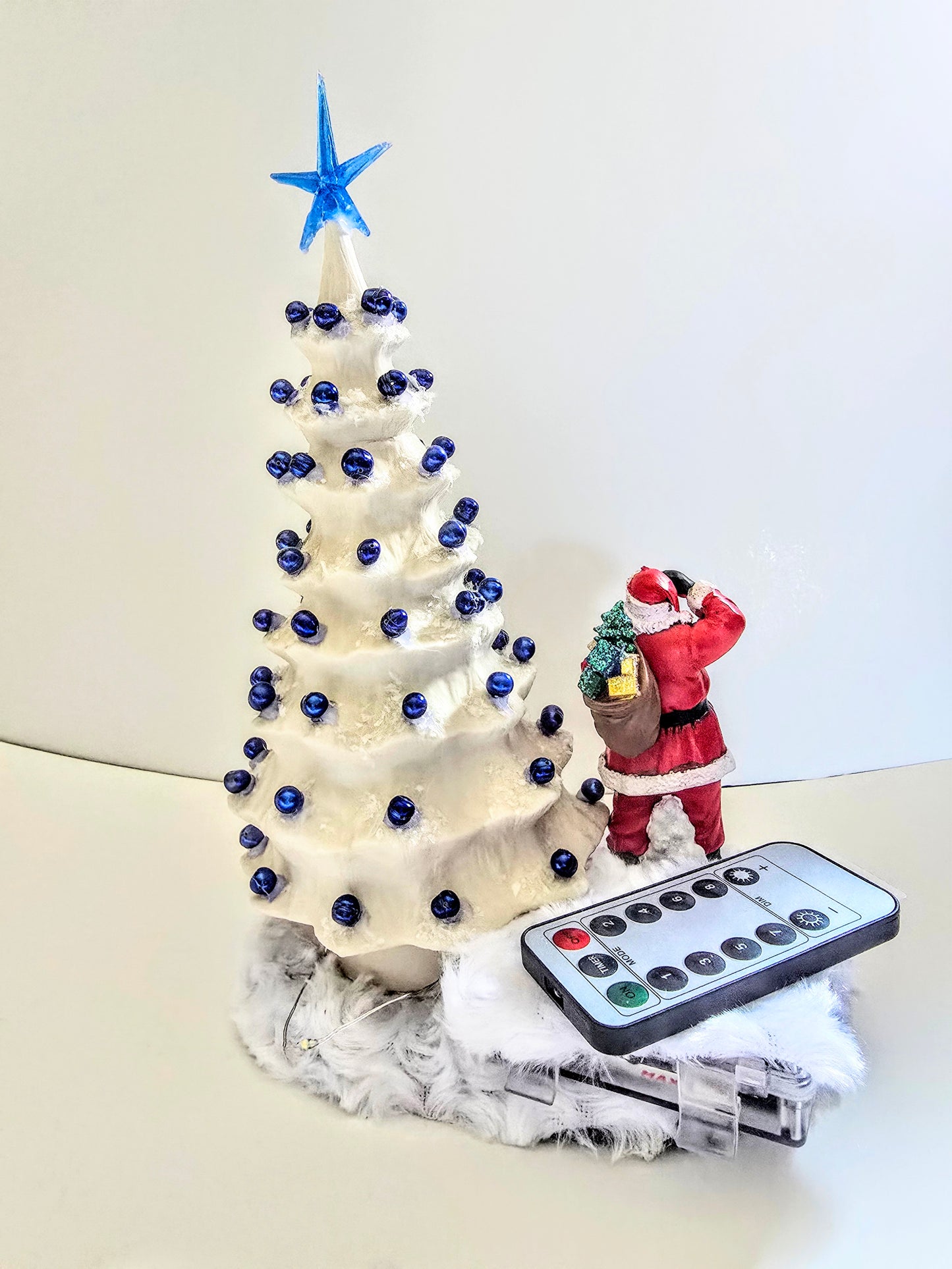 White Christmas Tree. Made Of Porcelain Blue Beads And Blue Lights. 11 By 7 Inch