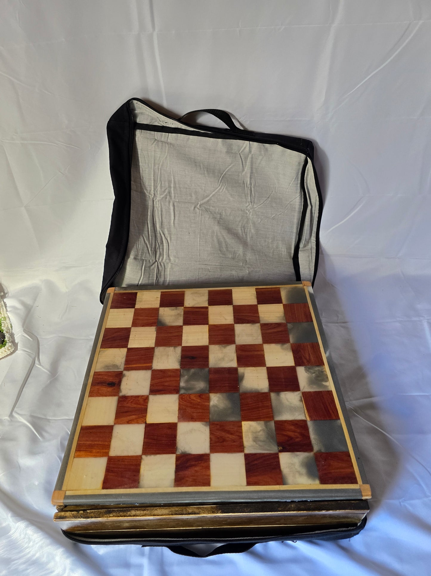 Wood and resin chess set with ceramic pieces. Red and white 18 by 18 inch board.