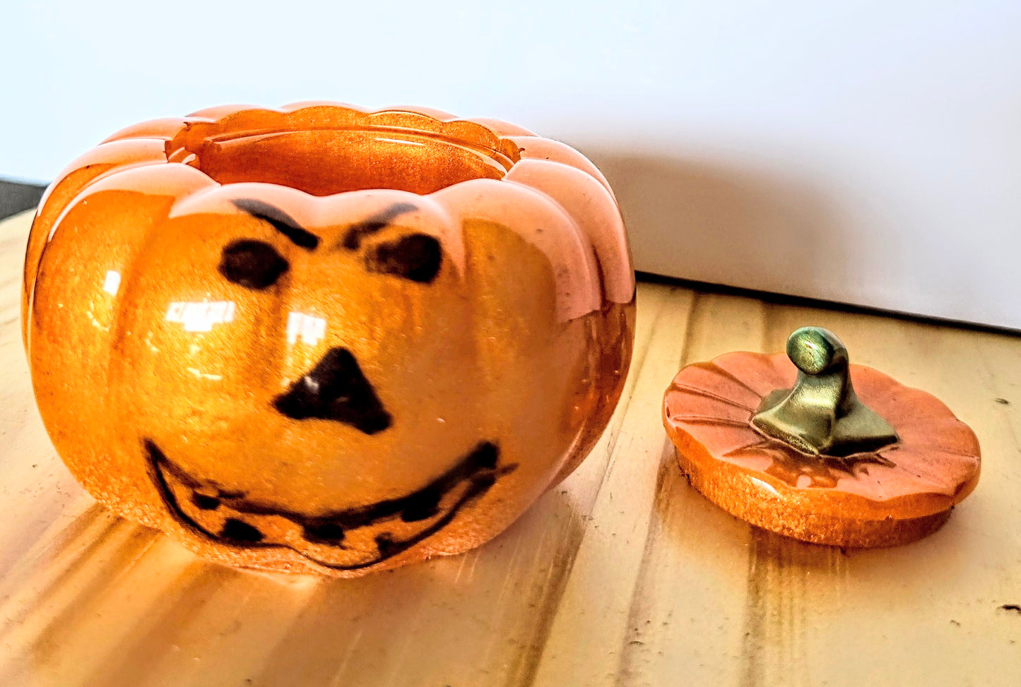 The Little Resin Pumpkin is a fun Halloween decoration measuring 4 by 3 inches.