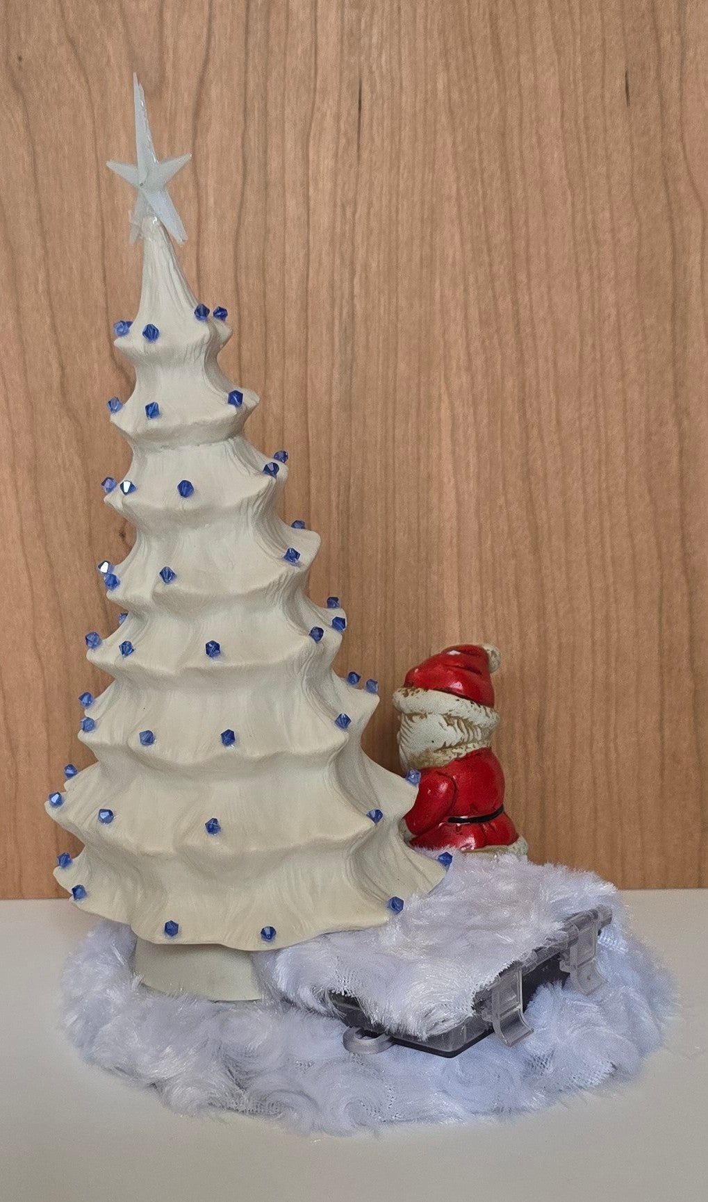 White porcelain Christmas tree with remote lights.