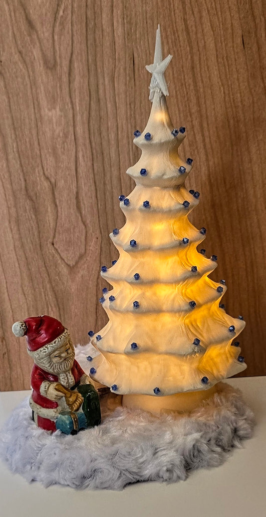 White porcelain Christmas tree with remote lights.