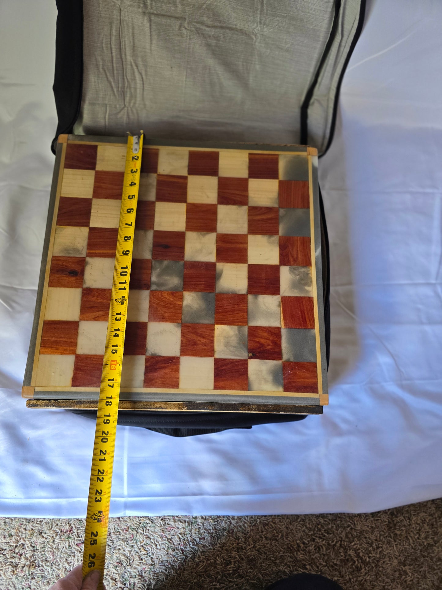 Wood and resin chess set with ceramic pieces. Red and white 18 by 18 inch board.