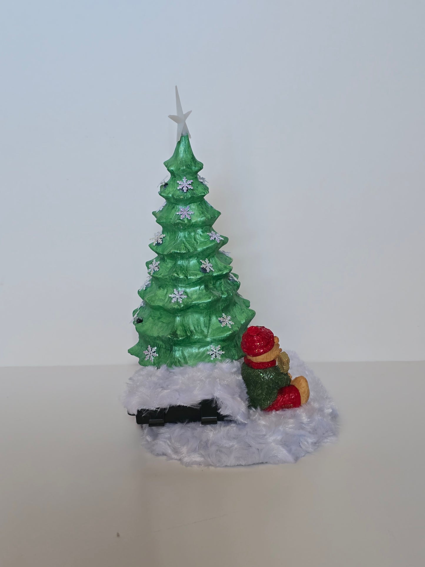 Ceramic Christmas tree with remote colored lights.
