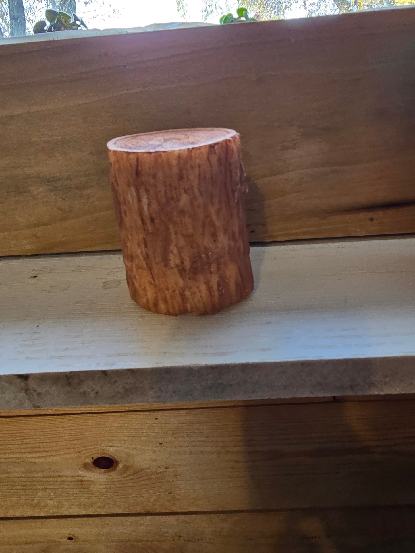 Handmade Little bear in a tree candle. 2 by 3 and 1/2 inch candle. Has a teddy bear in the tree stump.