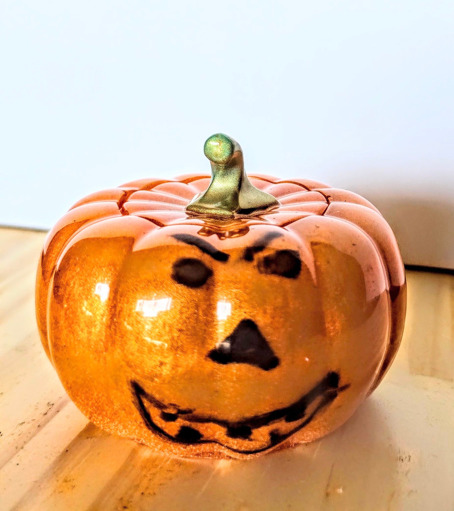 The Little Resin Pumpkin is a fun Halloween decoration measuring 4 by 3 inches.