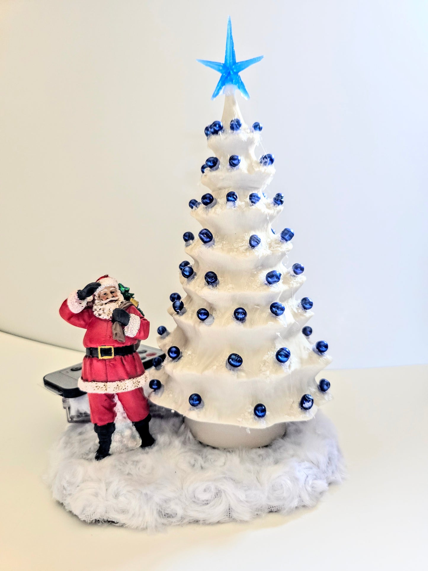 White Christmas Tree. Made Of Porcelain Blue Beads And Blue Lights. 11 By 7 Inch