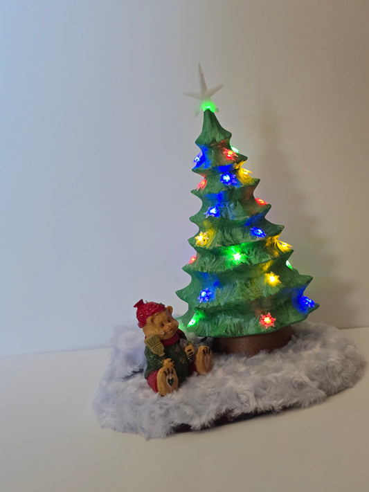 Ceramic Christmas tree with remote colored lights.